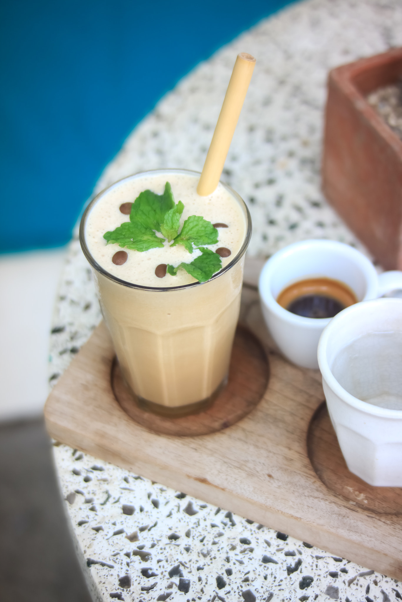 Iced Coffee with Mint Garnish by the Poolside – Summer Café Vibes