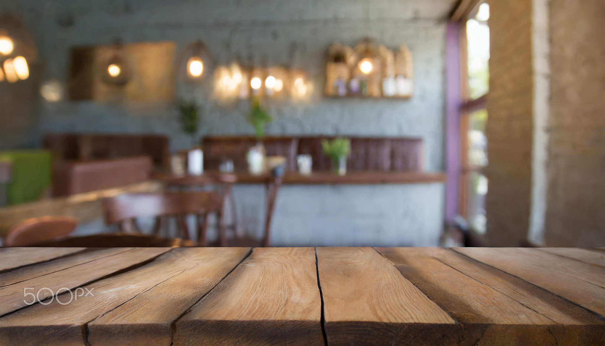 Empty dark wooden table blurred bokeh background 