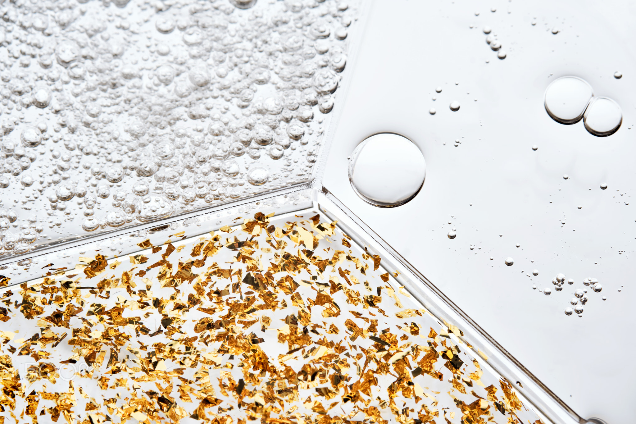 A petri dish with three textures of different serums.