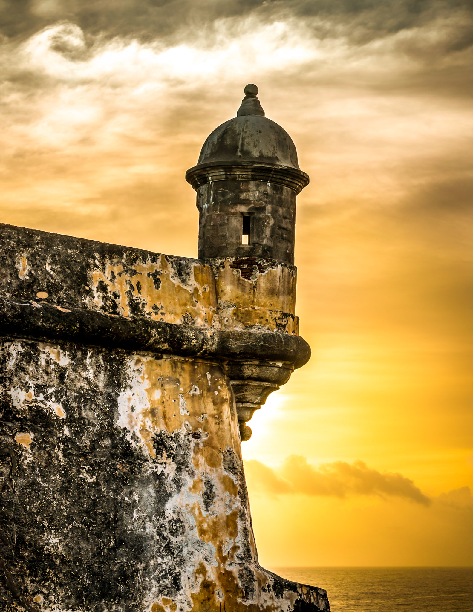 View of old building against sky during sunset