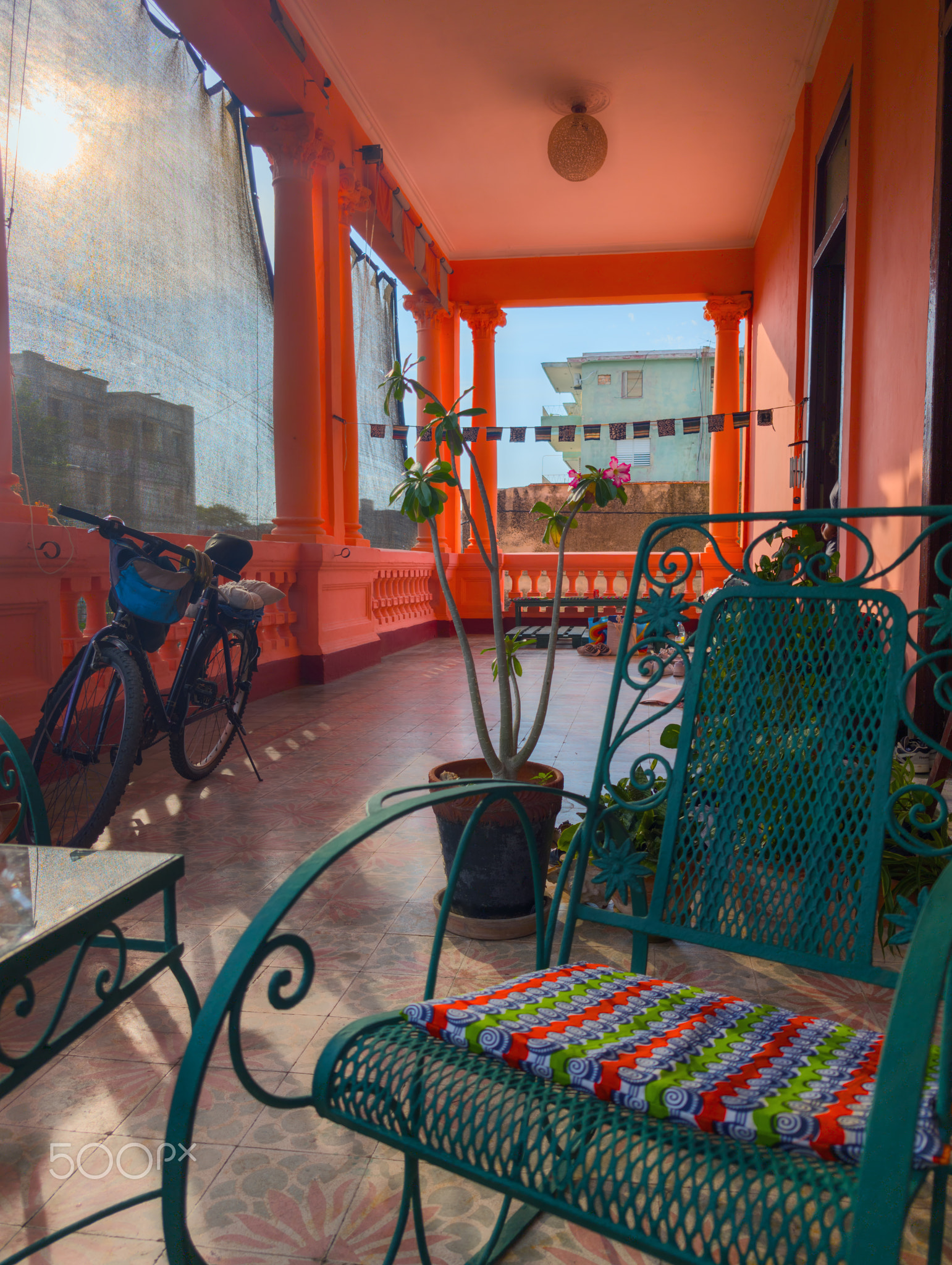 A traditional metal chair on a large terrace