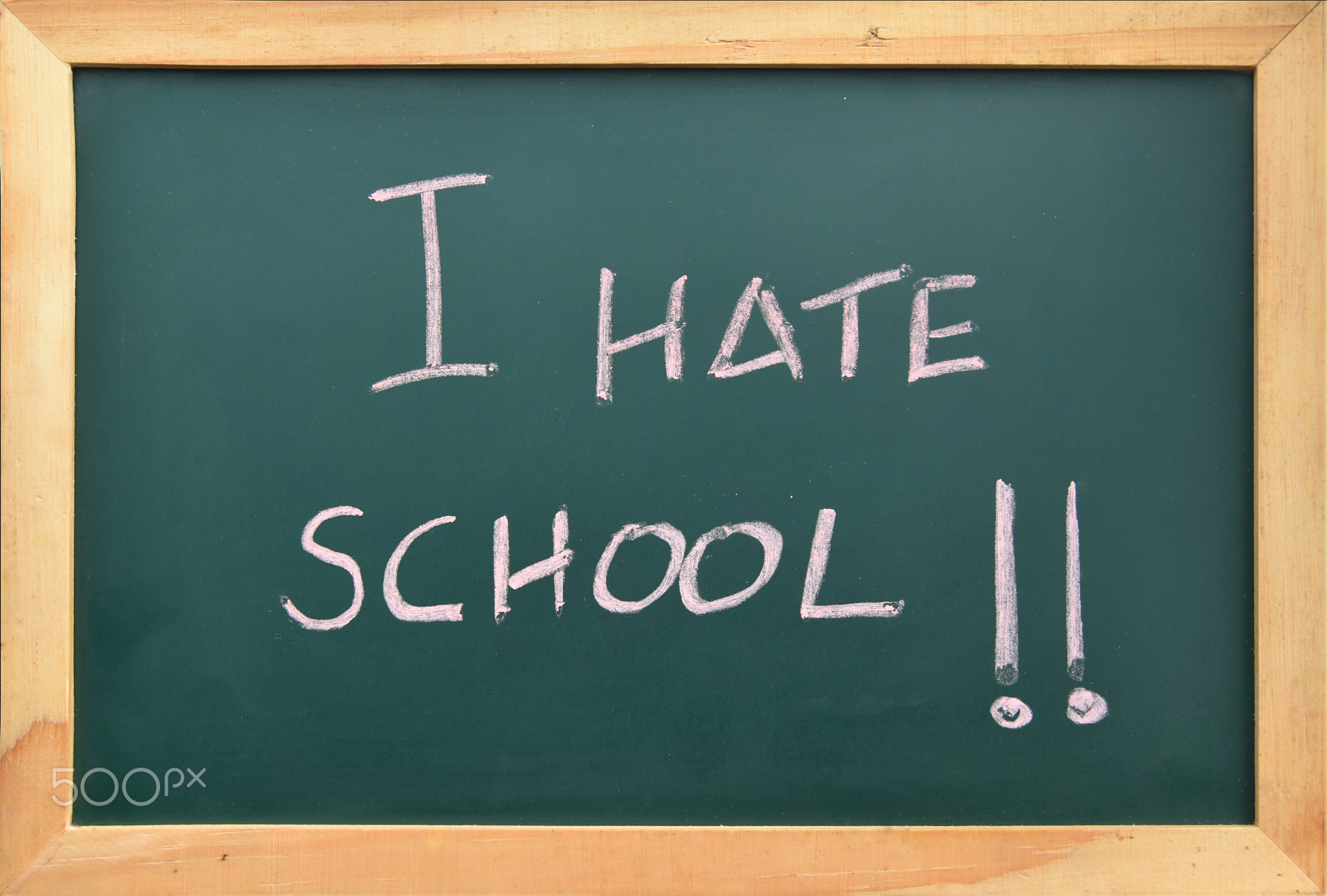 I hate school sign with exclamations on blackboard.