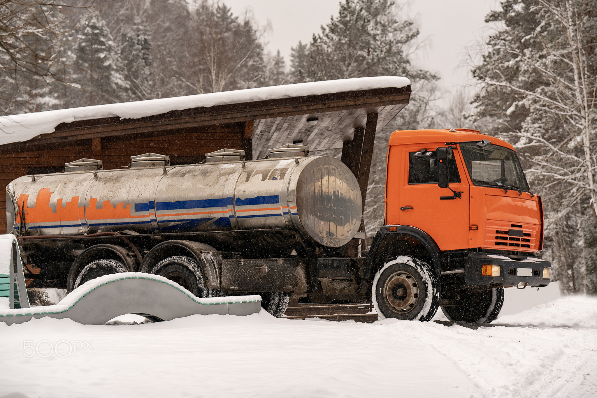 Truck with a tank for water delivery in winter.