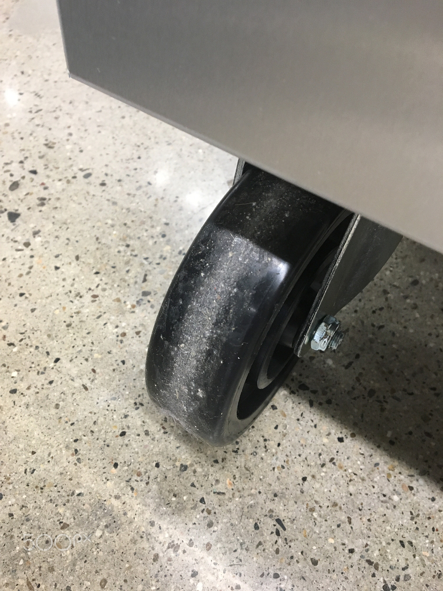 Caster Wheel with Wear Marks on an Industrial Freezer