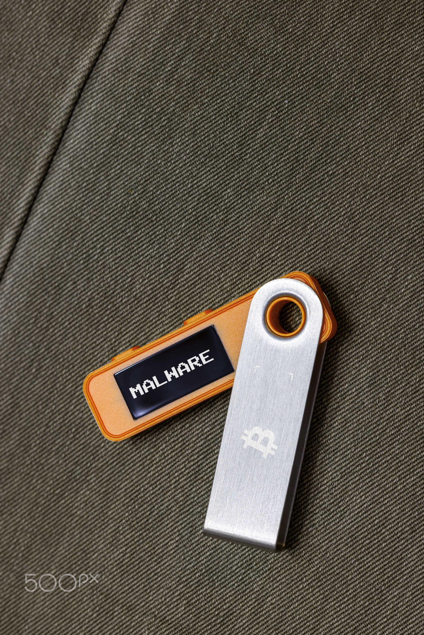 hardware Bitcoin wallet in with Malware message on screen