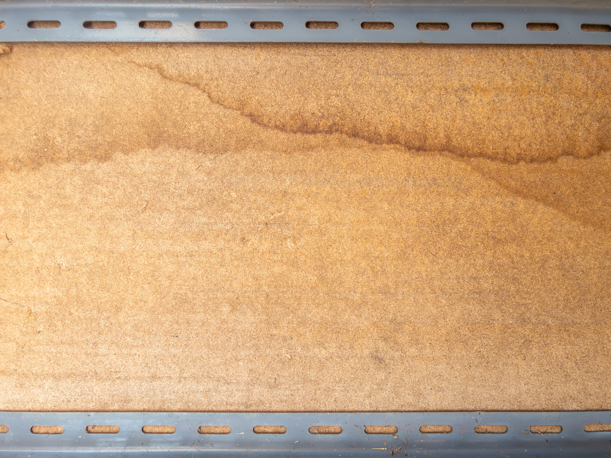Plywood Board Mounted on Metal Brackets for Shelf Construction.