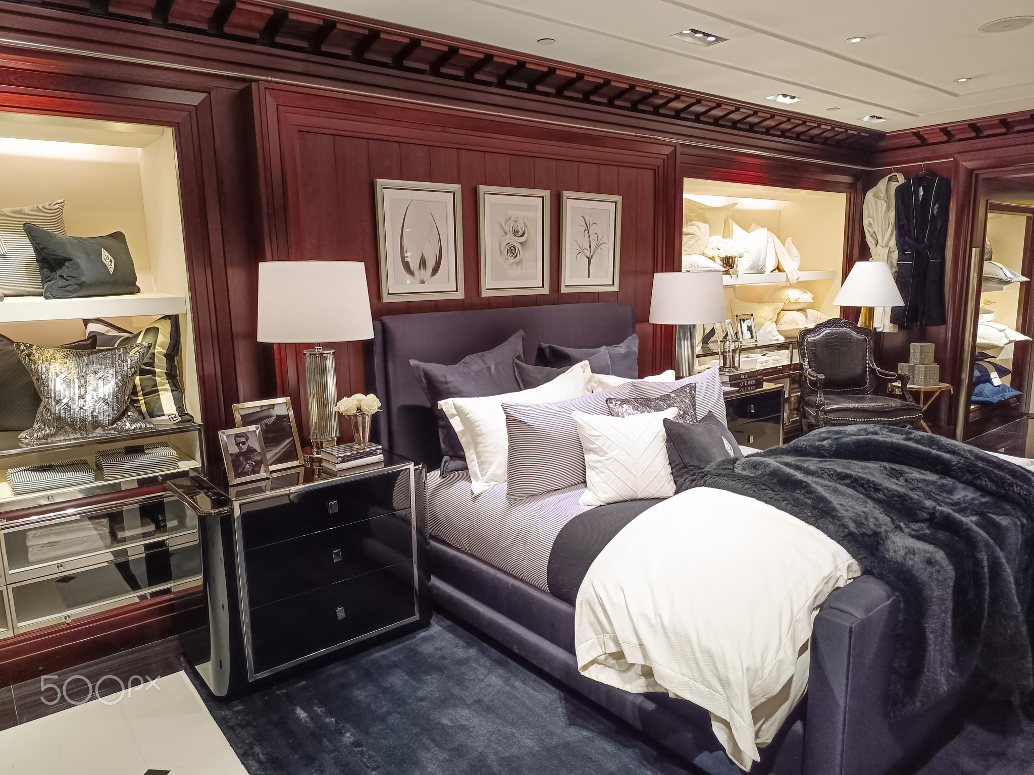 Luxury bedroom showroom display with tufted bed. London, UK, 8 June 2024