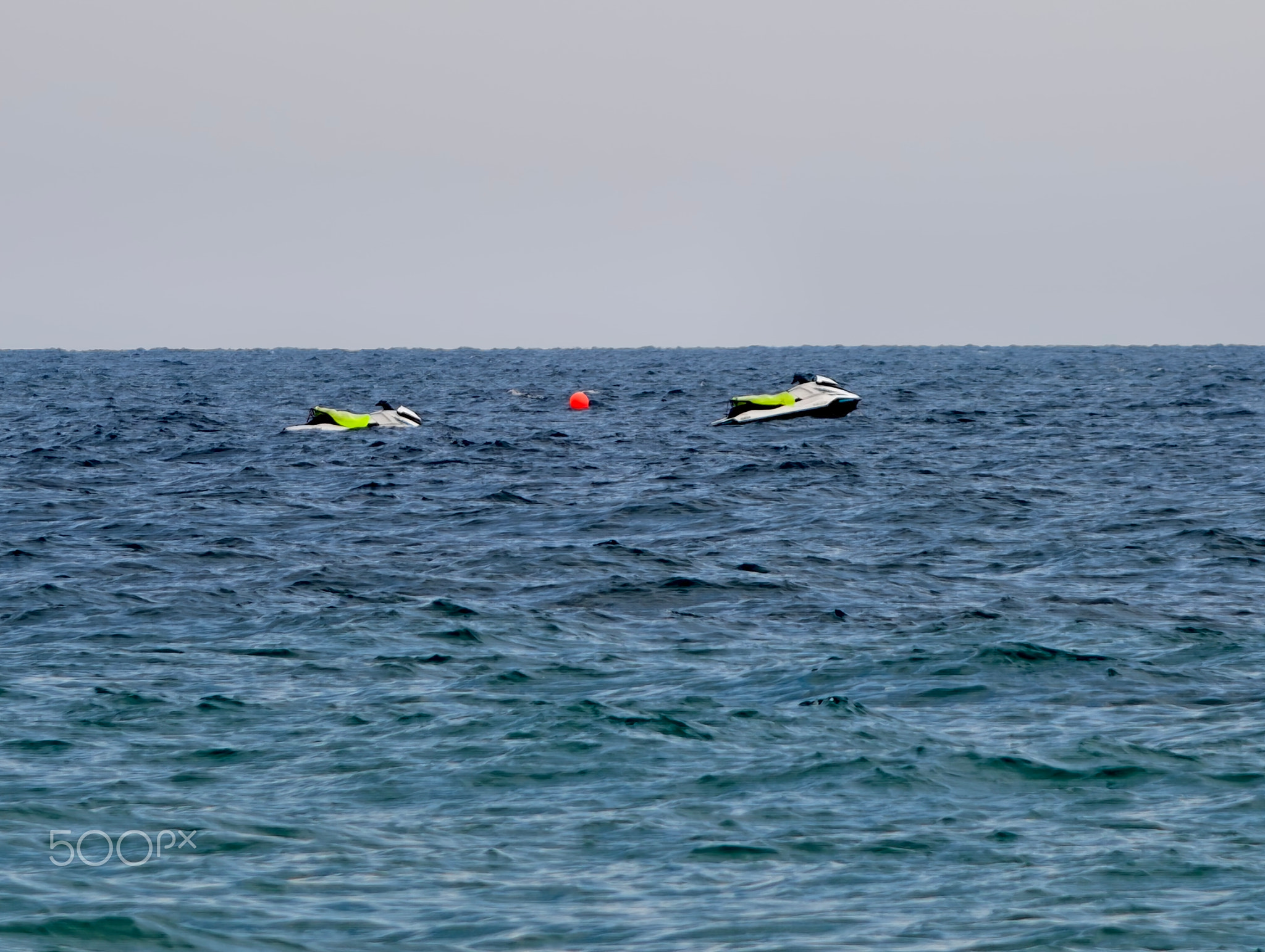 an energetic summer outing featuring riders skimming across blue waves with wakes trailing behind