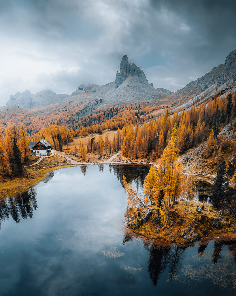 Mountain Lake Reflecting Autumn Colors Evoking Grandeur and