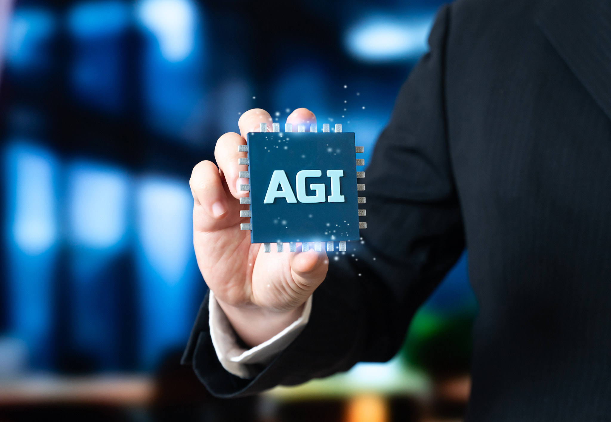 Artificial General Intelligence microchip in the hand of a businessman. A new stage in AI developmen