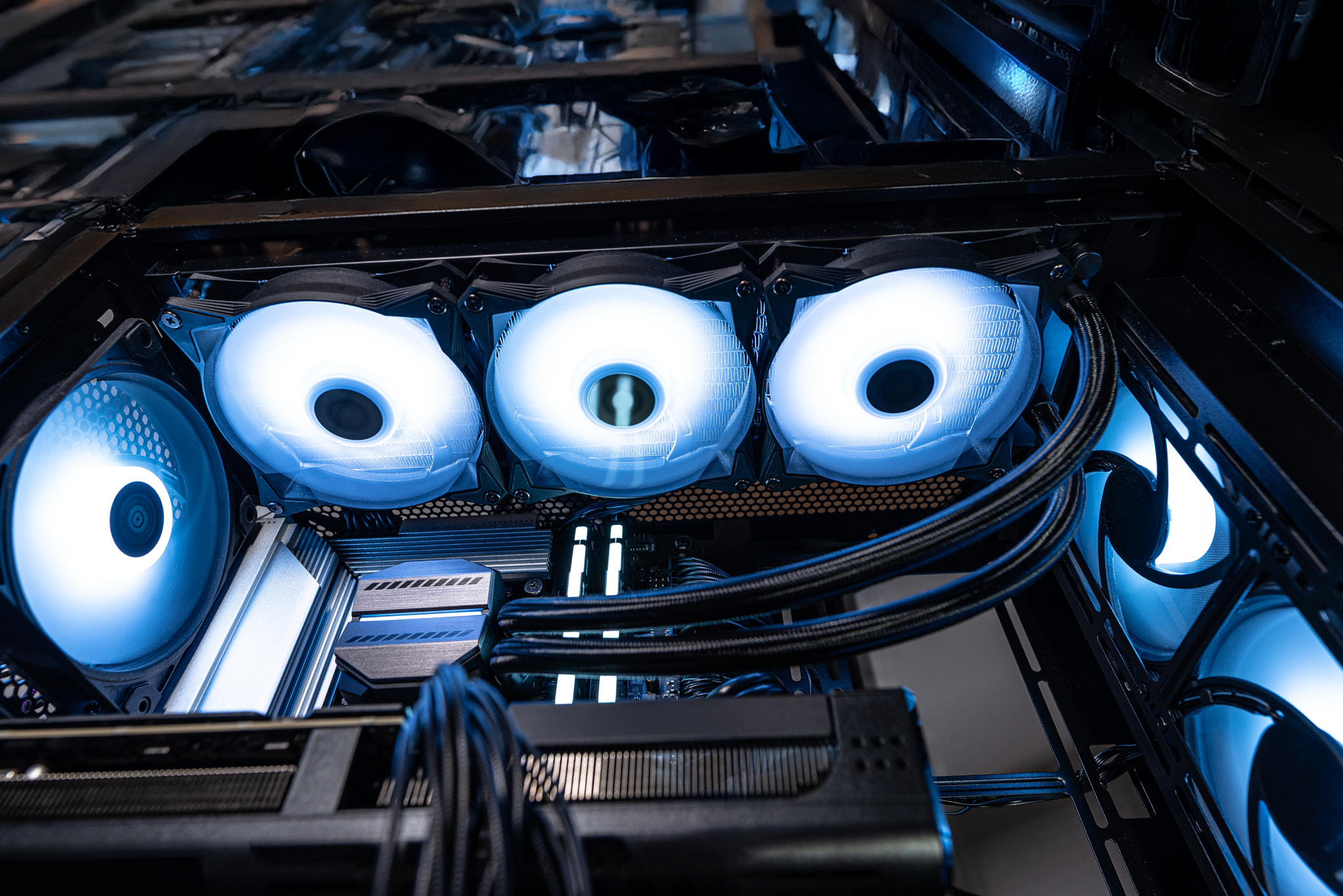 The inside of a modern computer assembled in 2025, showing DDR5 memory and other components.