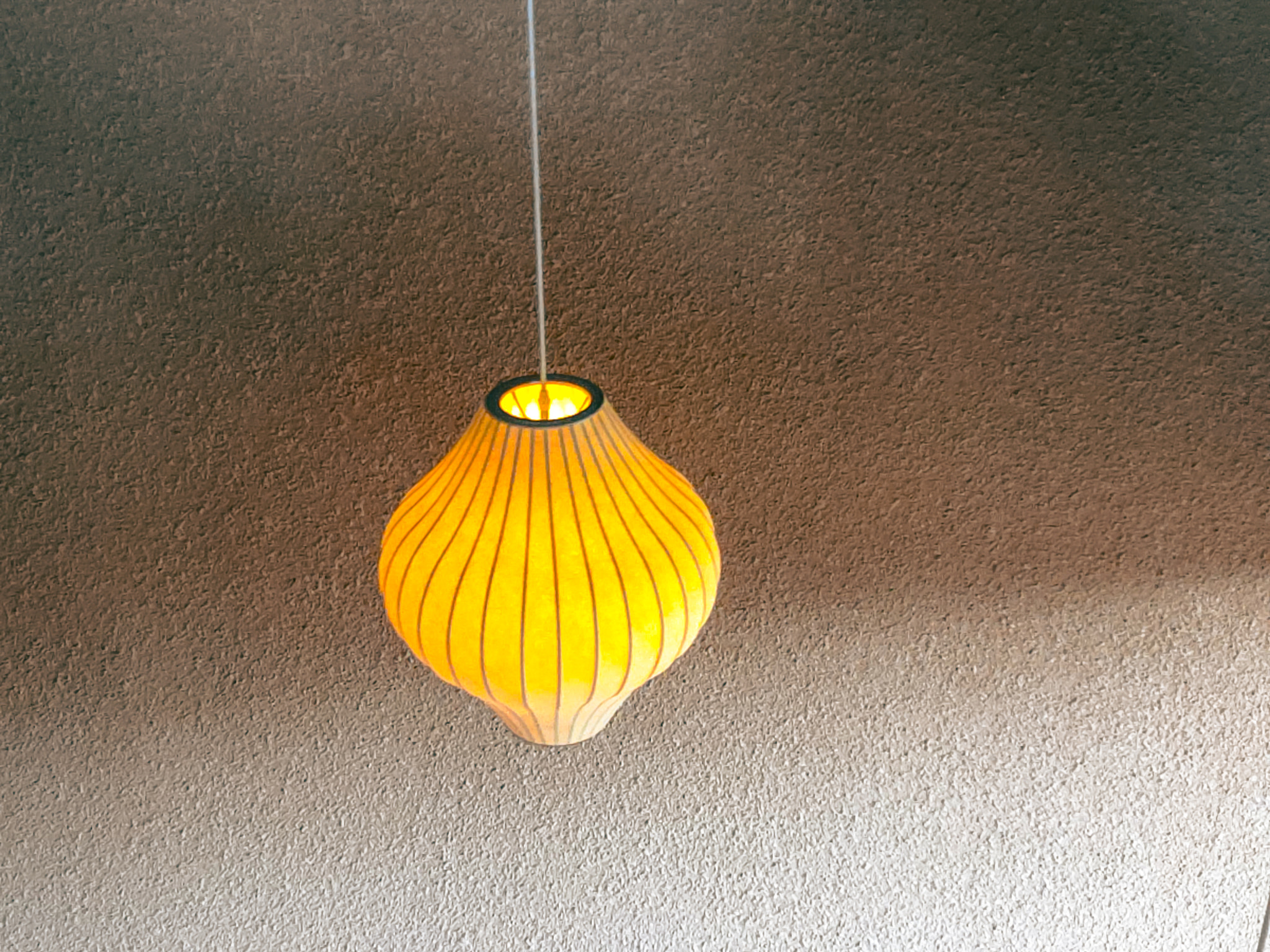 Modern Linear Pendant Light over Minimalist Dining Table