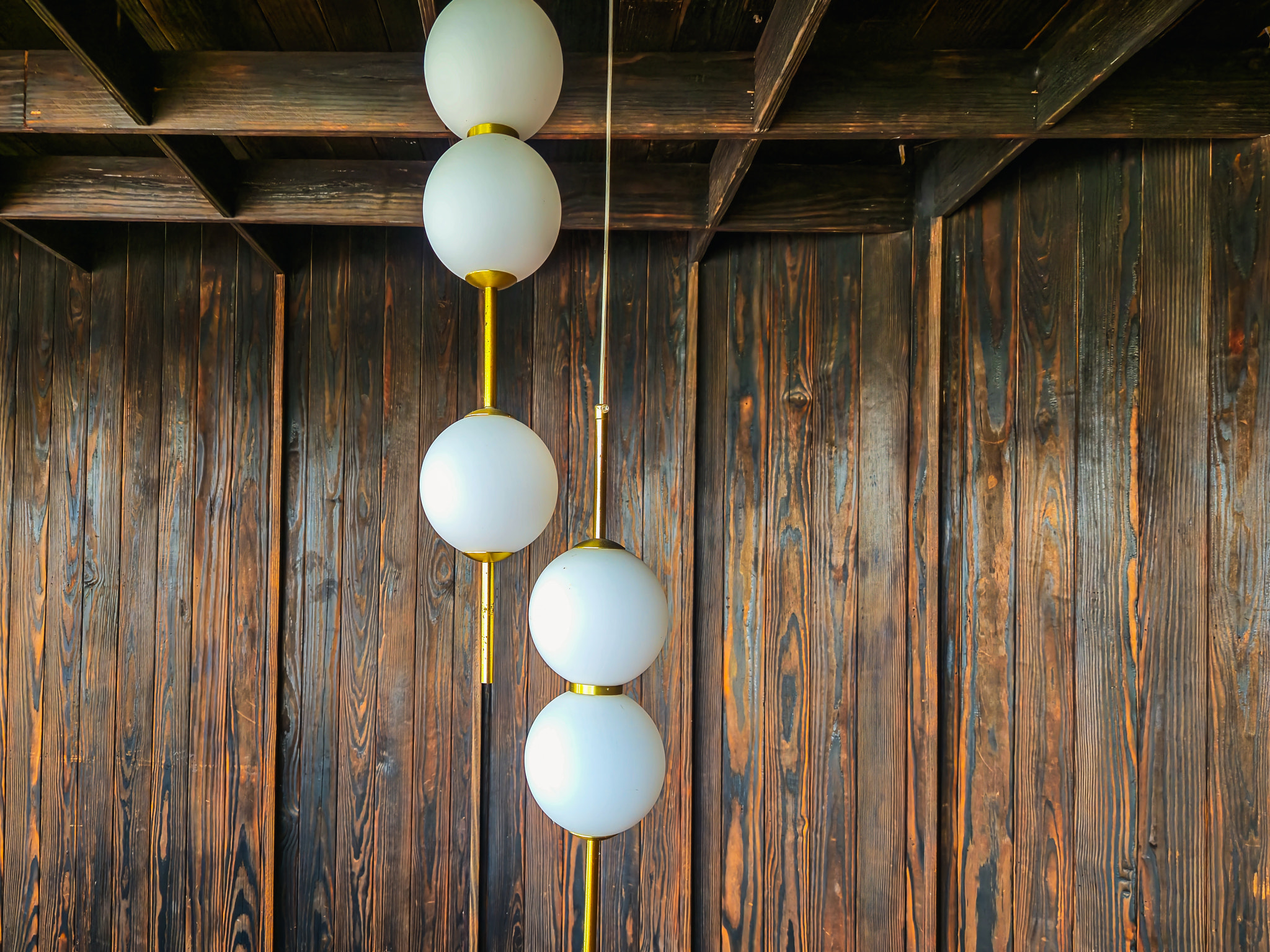 Modern Linear Pendant Light over Minimalist Dining Table