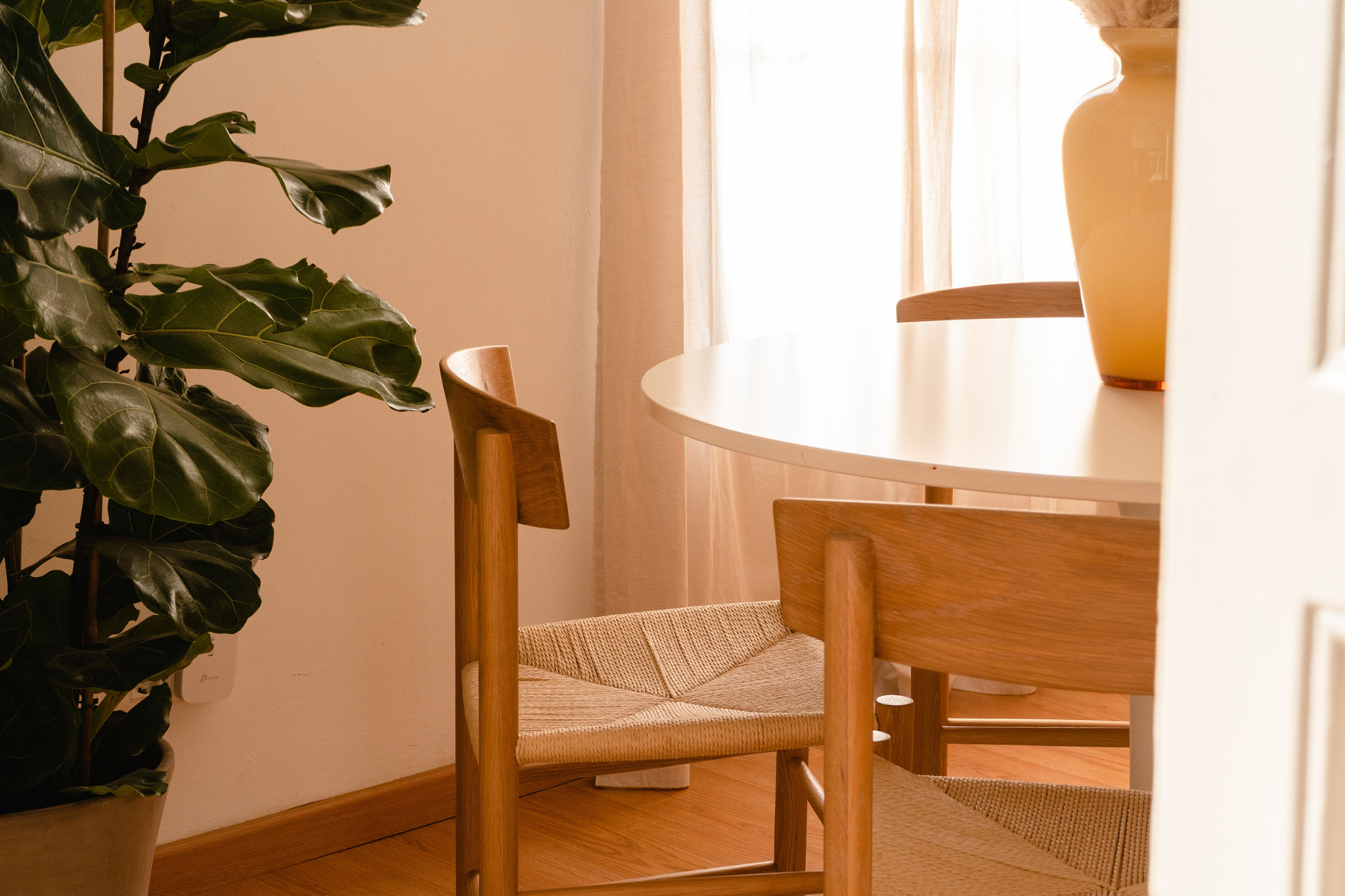 #V Midsection of woman standing by window at home