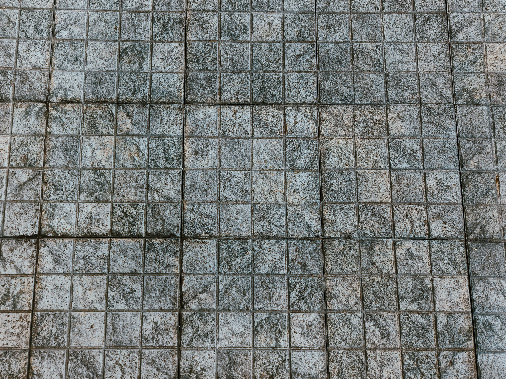 Abstract Geometric Grid Pattern on Stone Floor Surface