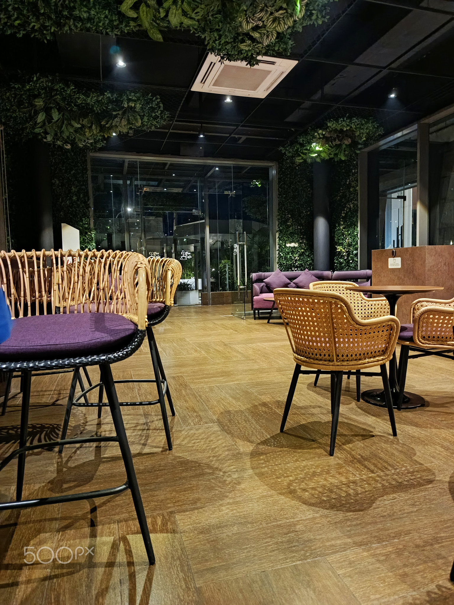 Empty chairs and tables in restaurant
