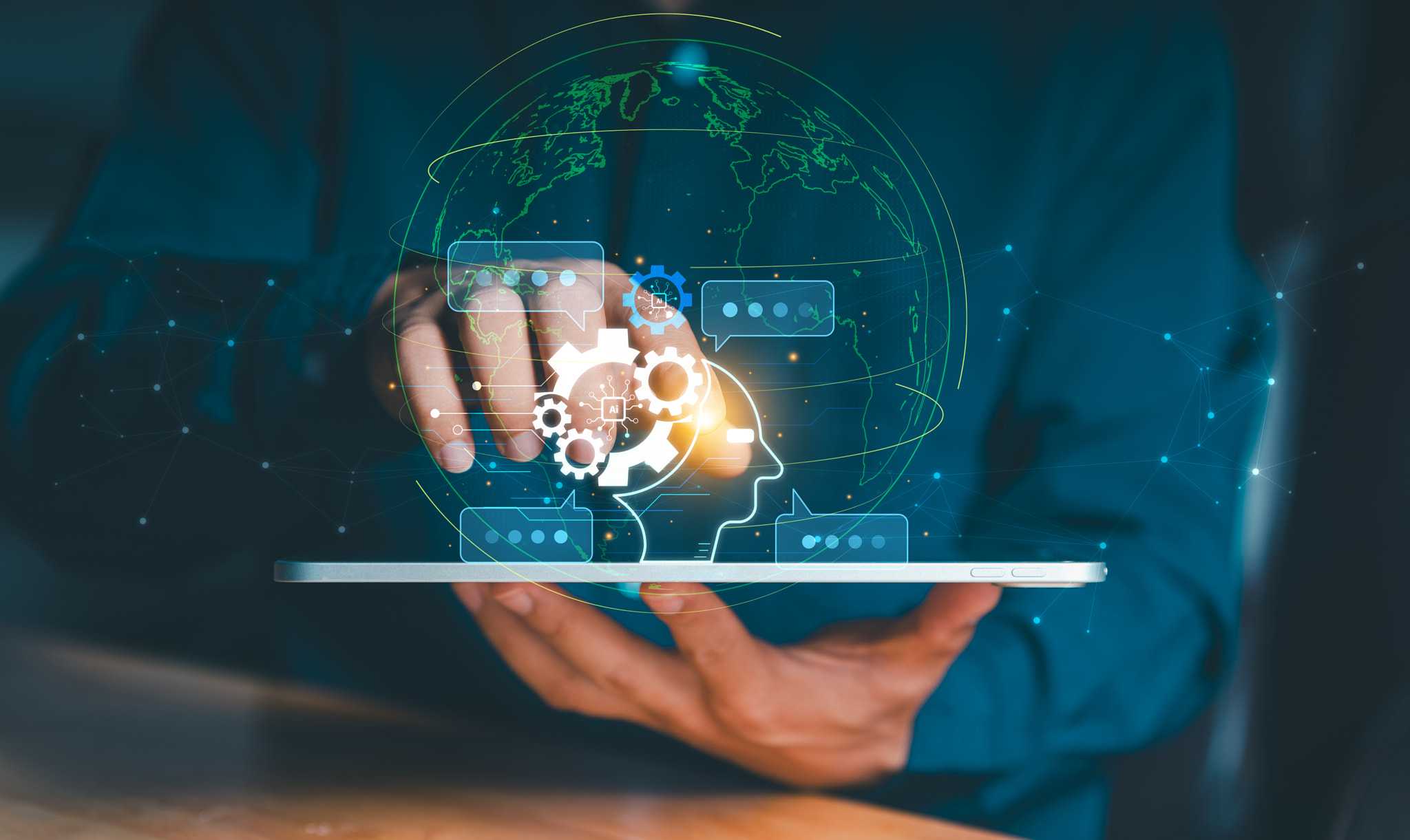Businessman using tablet with global network interface and AI head icon. Concept of worldwide digita