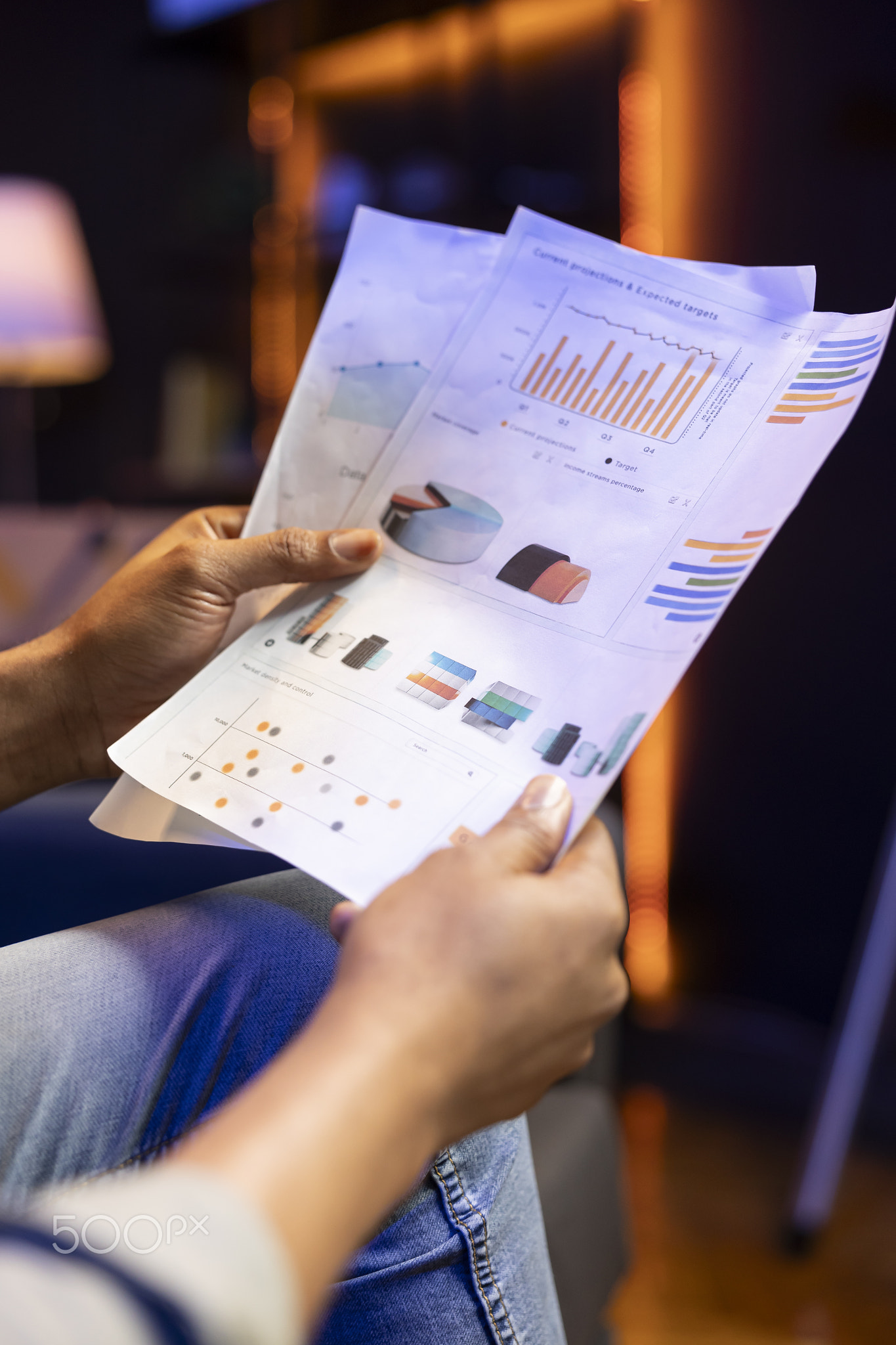 Male freelancer does research by reading articles and data driven papers