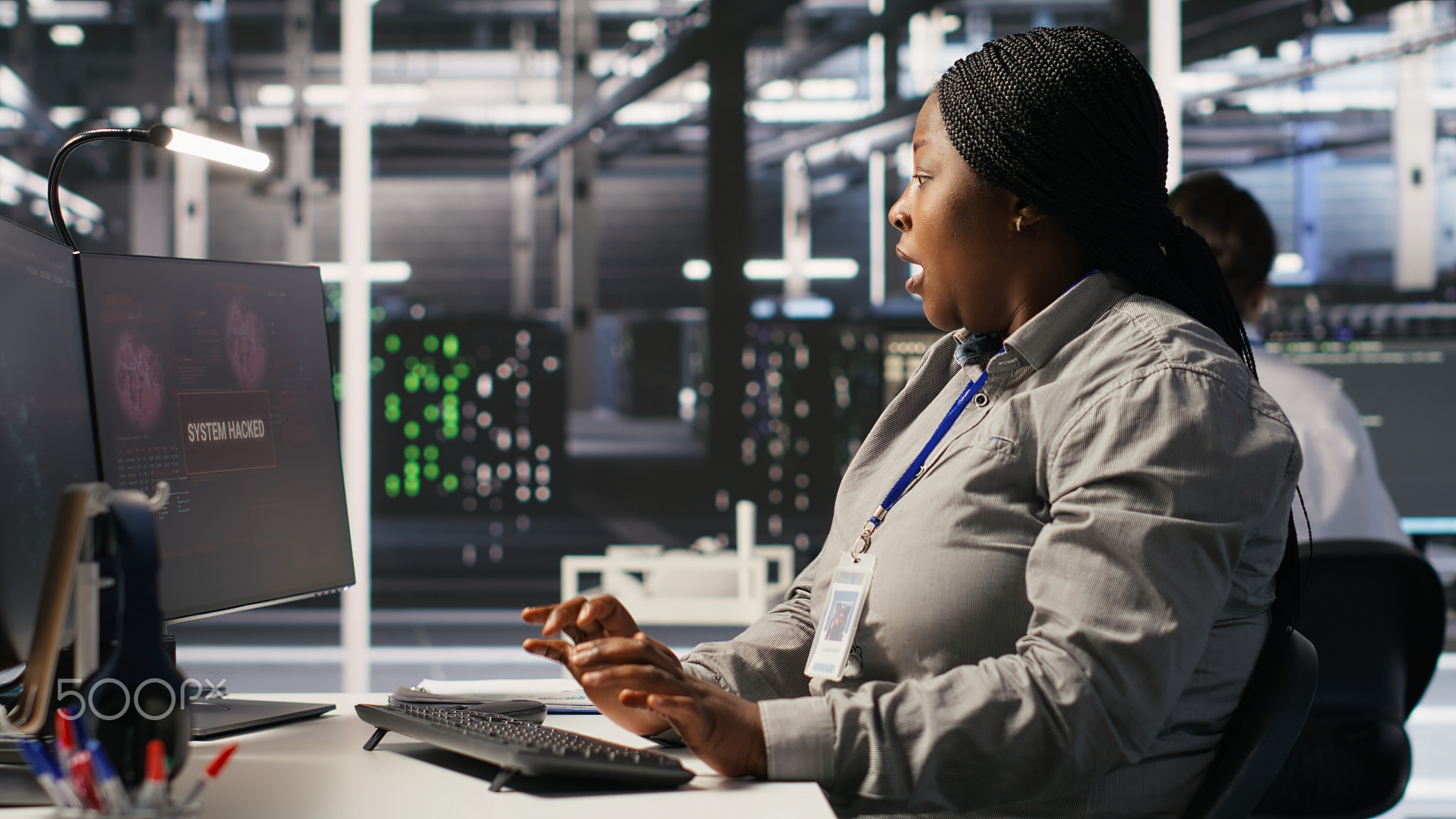 Panicked system administrator in data center reacting to spyware warning