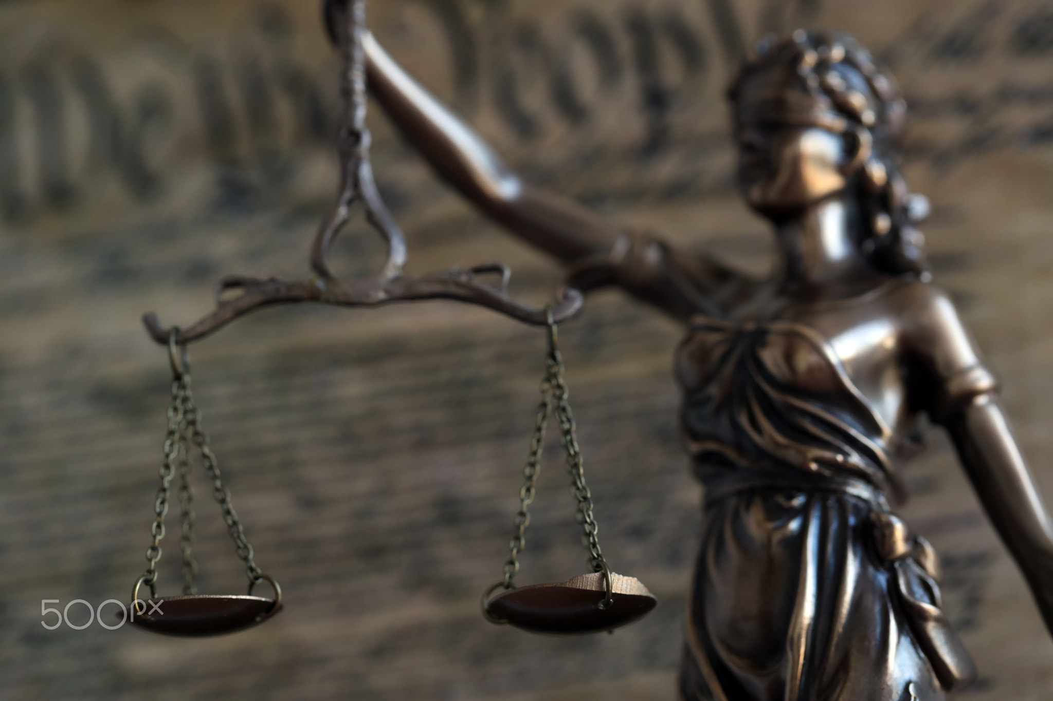 Dark scene with Lady Justice and US Constitution page. Lawsuit and judgement in USA