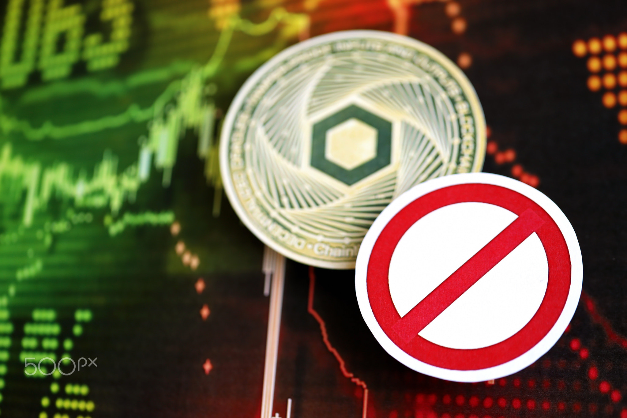 Chainlink LINK coin and red paper prohibition sign on chart background