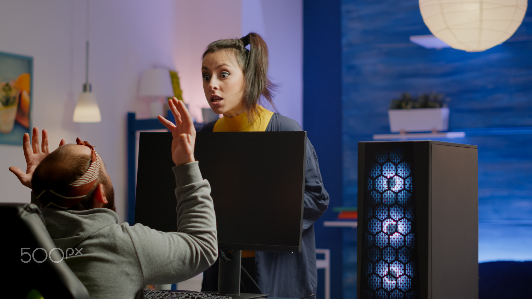 Wife arguing with man gamer during space shooter videogame tournament