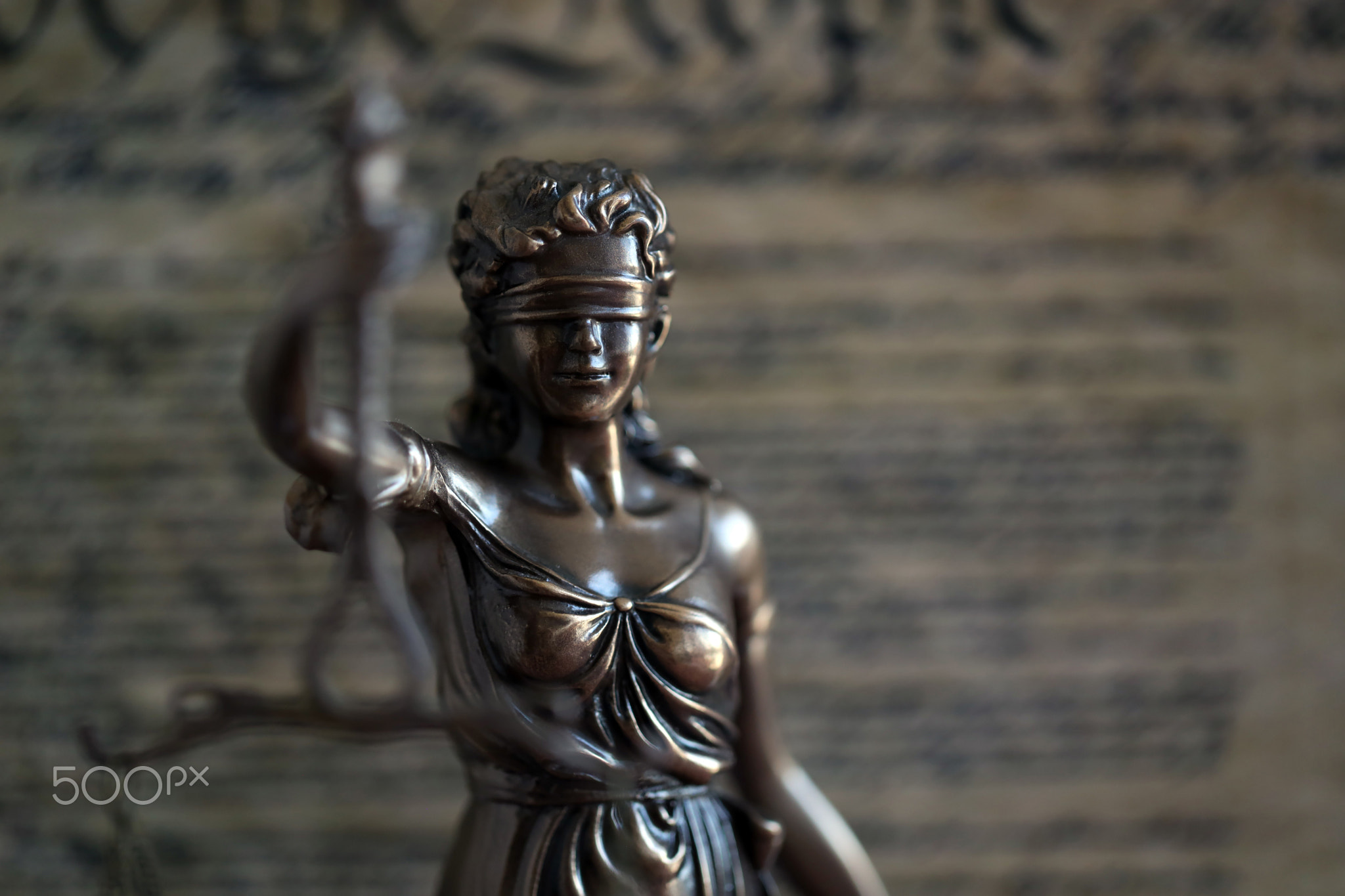 Dark scene with Lady Justice and background of Constitution page. Lawsuit and judgement in US