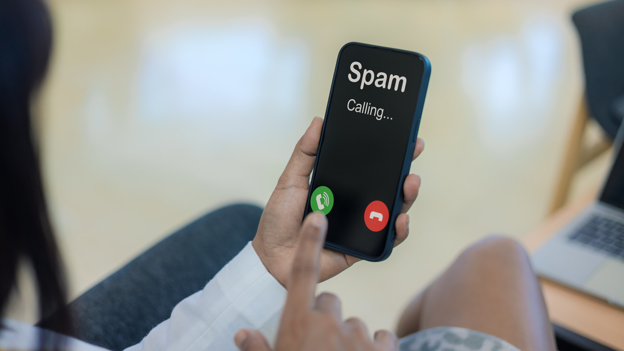 Spam call notification on smartphone screen alert. Cyber scam and telemarketing fraud protection con