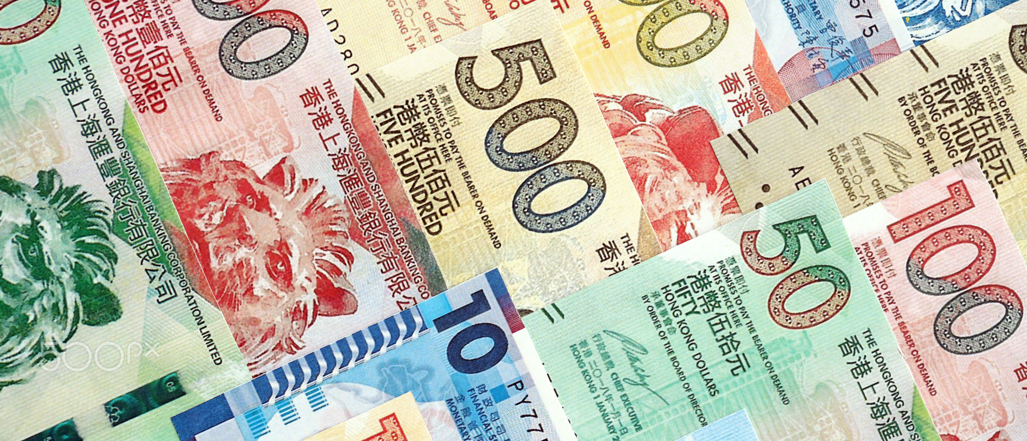 Big pile of Hong Kong dollars money bills banknotes. Lots of money of Chinese Hong Kong HKD cash