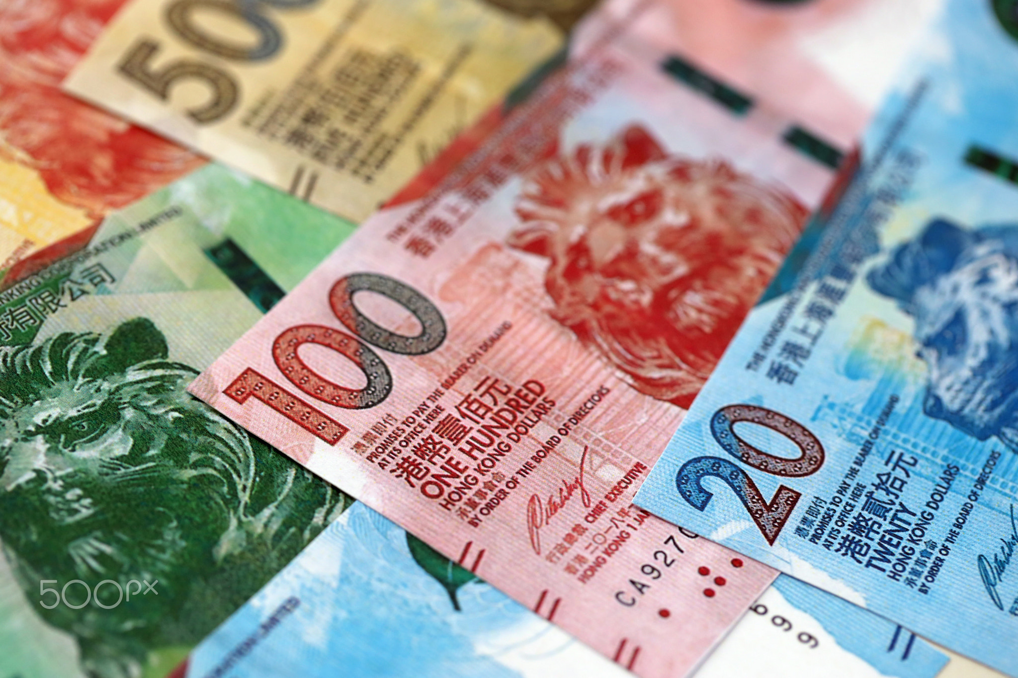 Big pile of Hong Kong dollars money bills banknotes. Lots of money of Chinese Hong Kong HKD cash