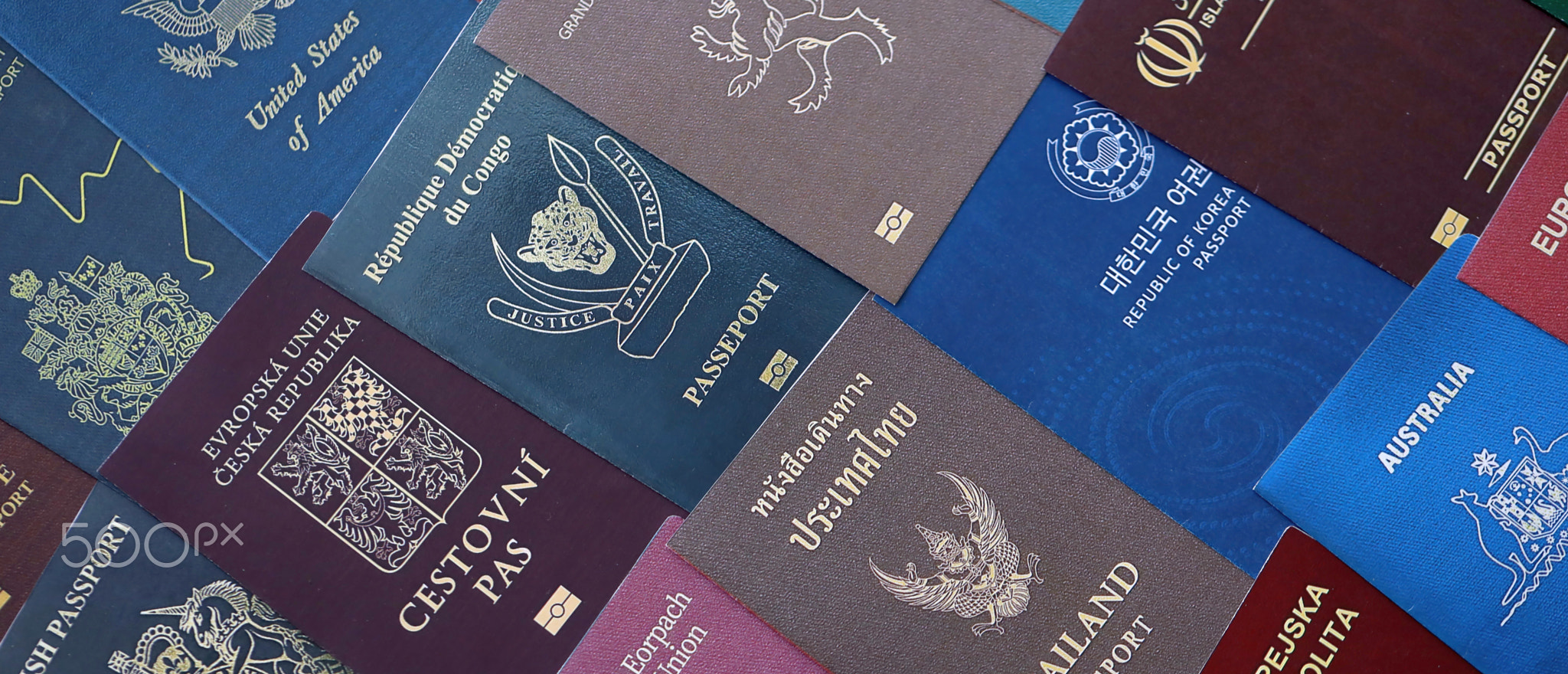 Big amount of passports of various different countries. Covers of expired passports close up