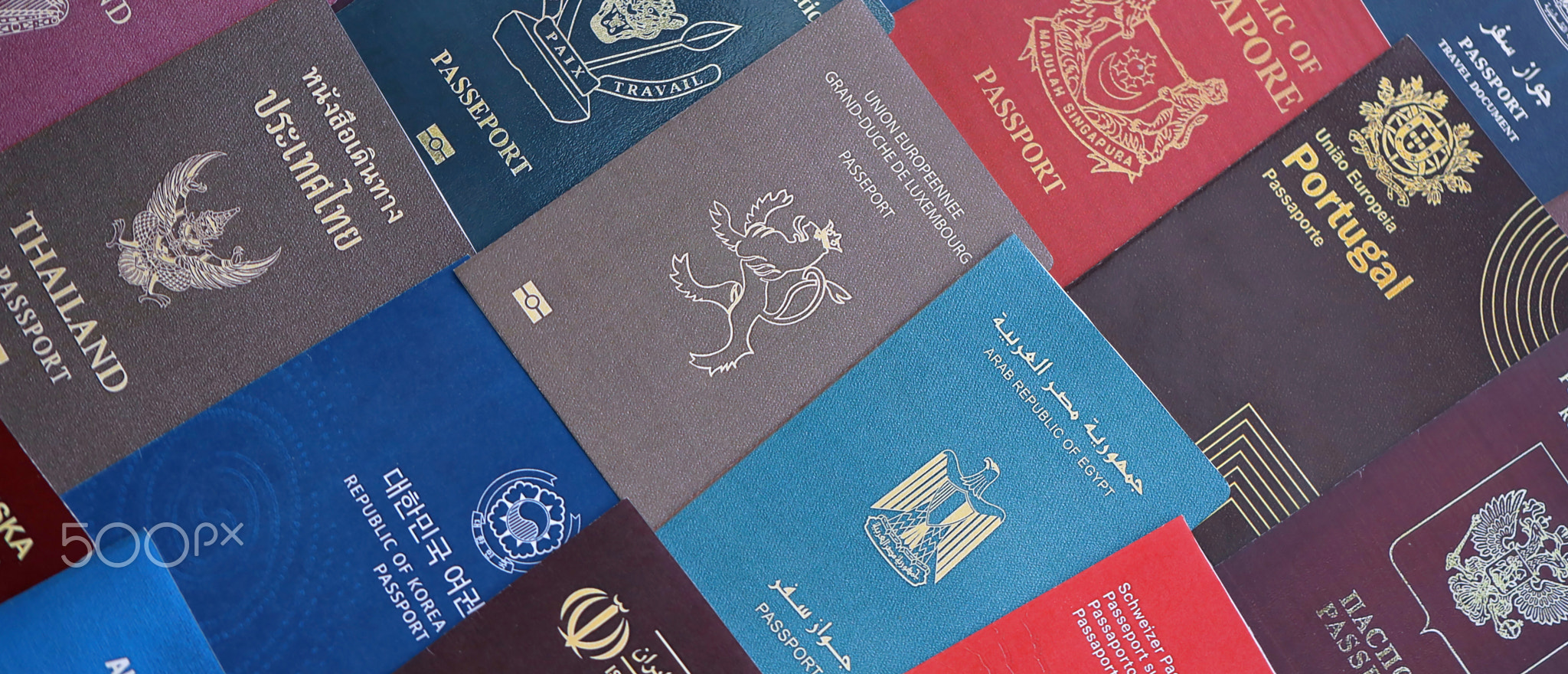 Big amount of passports of various different countries. Covers of expired passports close up