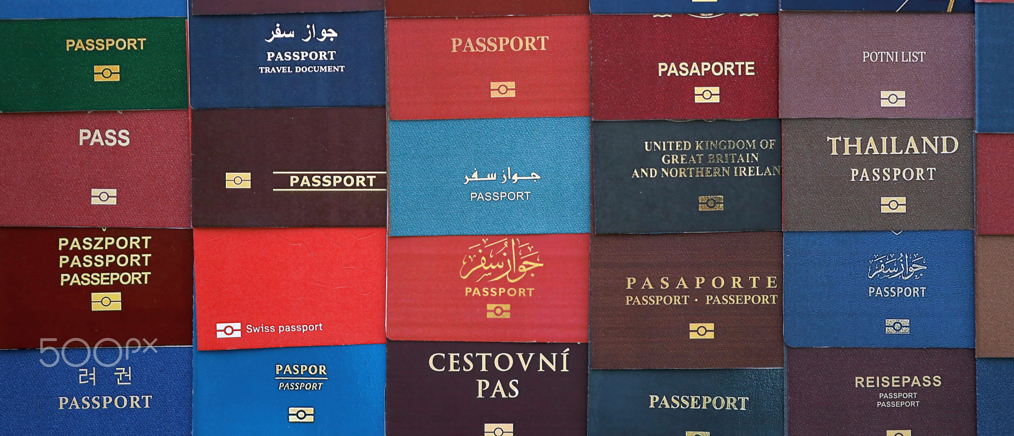 Big amount of passports of various different countries. Covers of expired passports close up