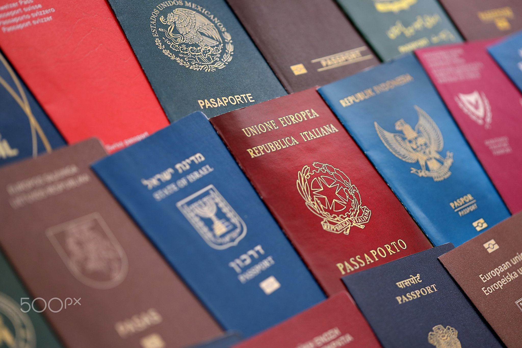 Big amount of passports of various different countries. Covers of expired passports close up