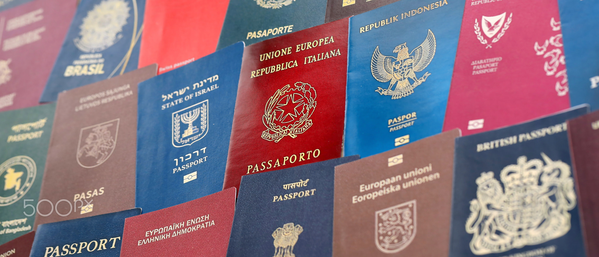 Big amount of passports of various different countries. Covers of expired passports close up