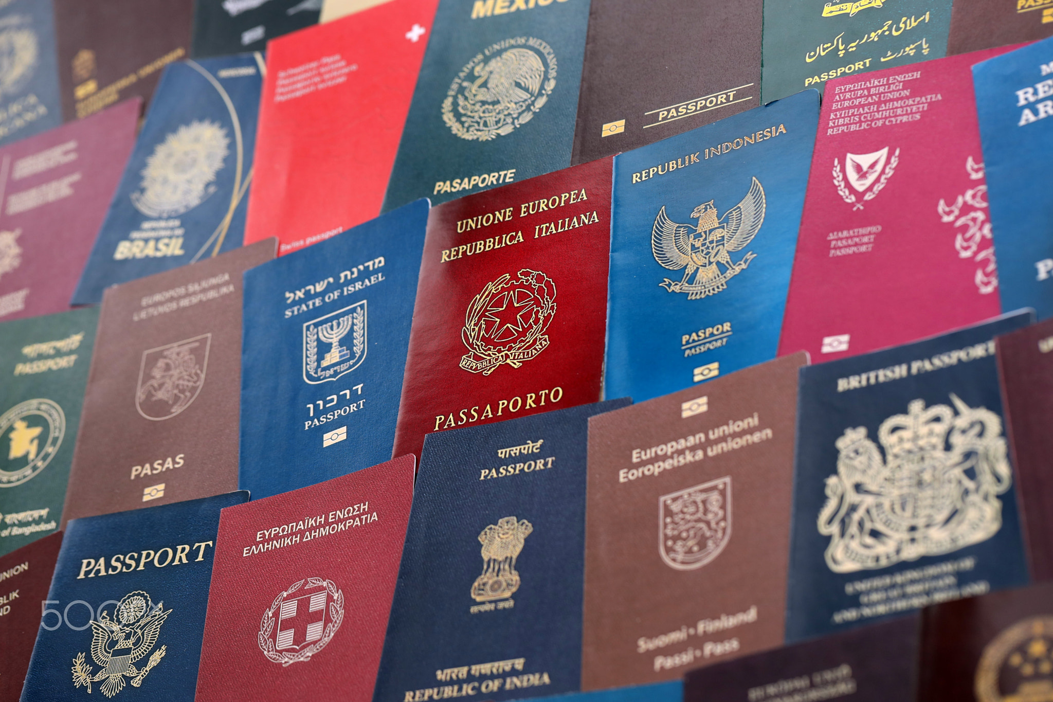 Big amount of passports of various different countries. Covers of expired passports close up