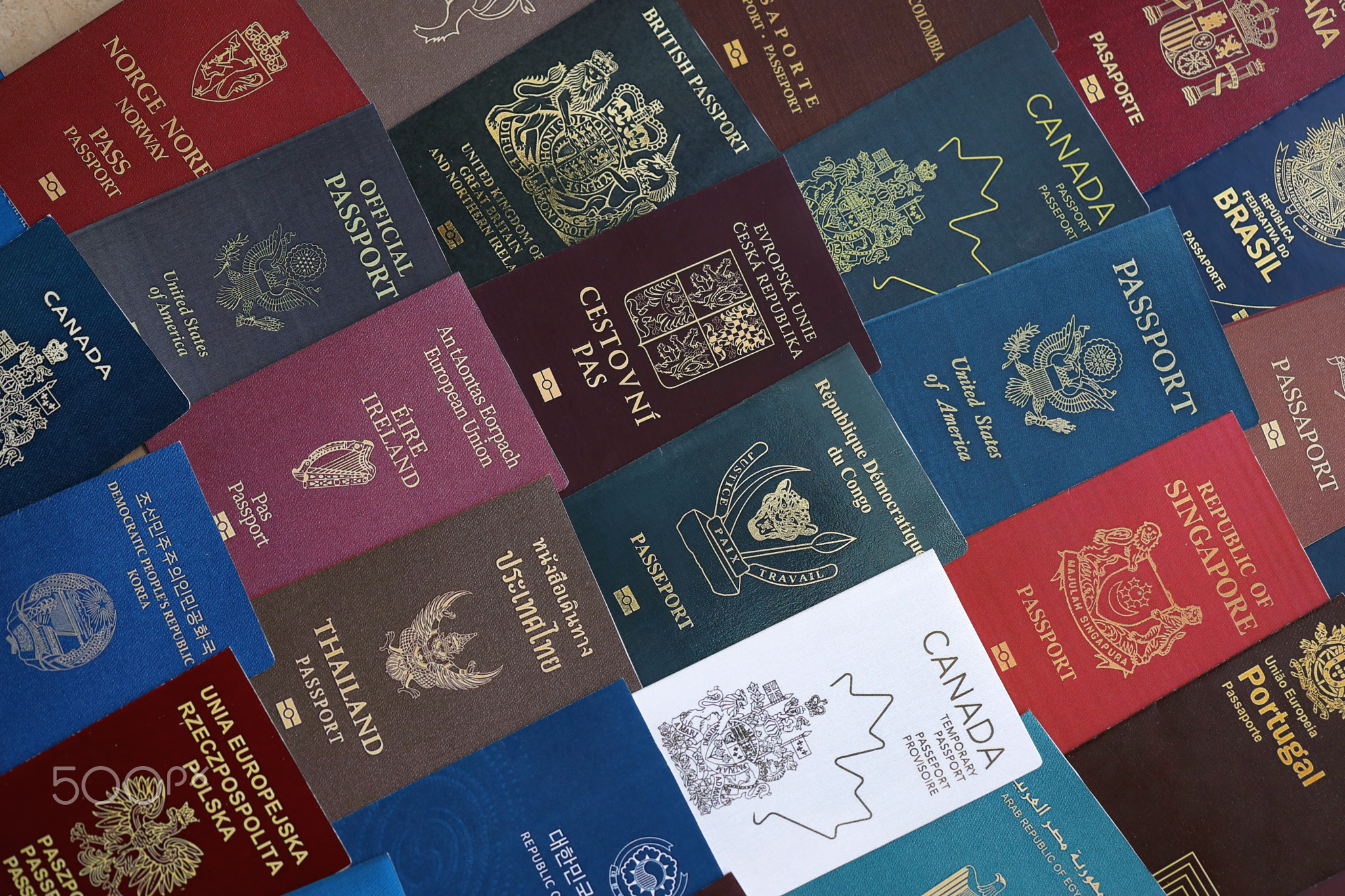 Big amount of passports of various different countries. Covers of expired passports close up