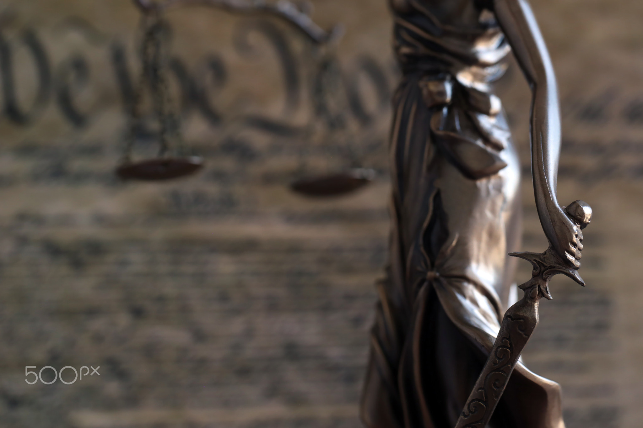 Dark scene with Lady Justice and US Constitution page. Lawsuit and judgement in USA