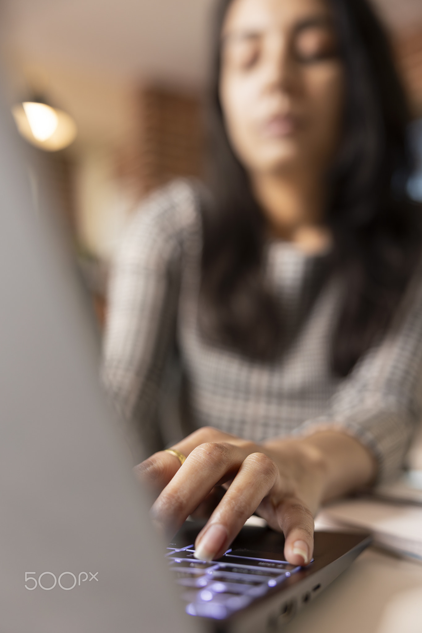 Close up of female professional gathering data on laptop