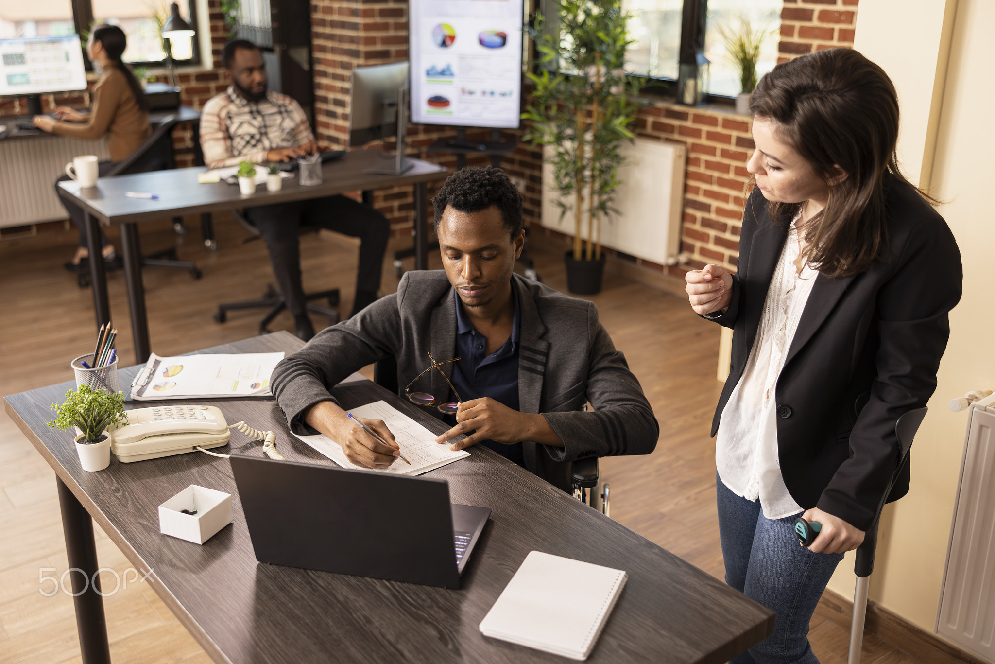 Diverse colleagues discuss strategy ideas