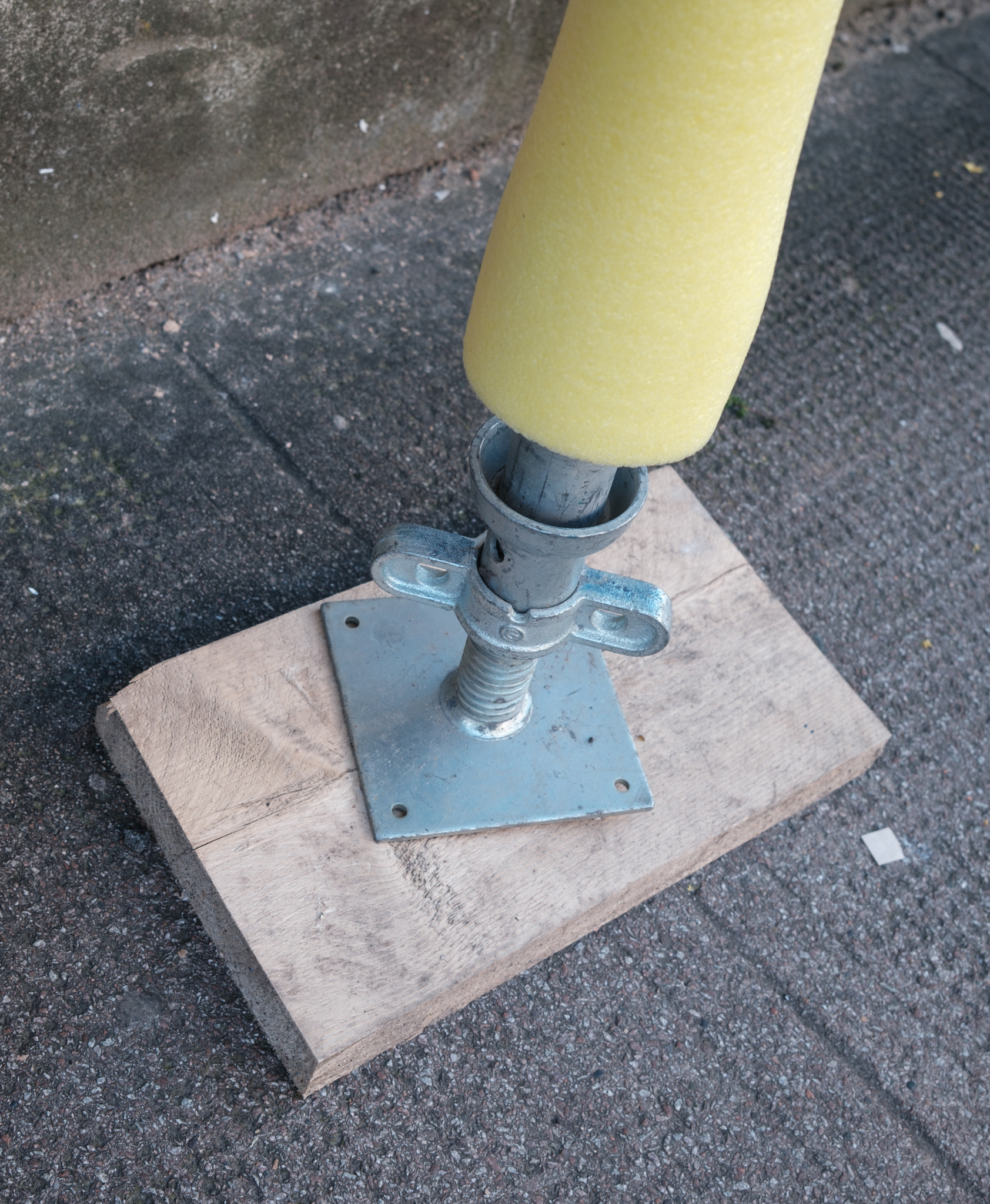 Scaffolding Base Plate On Wooden Block