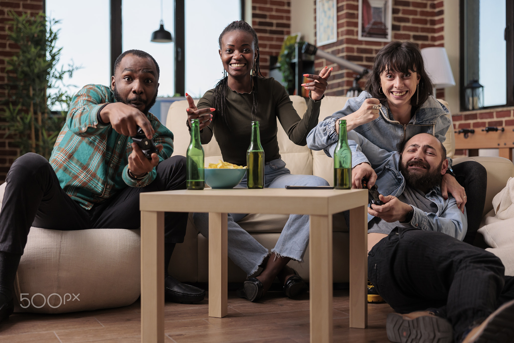 Diverse group of people enjoying video games play on gaming console