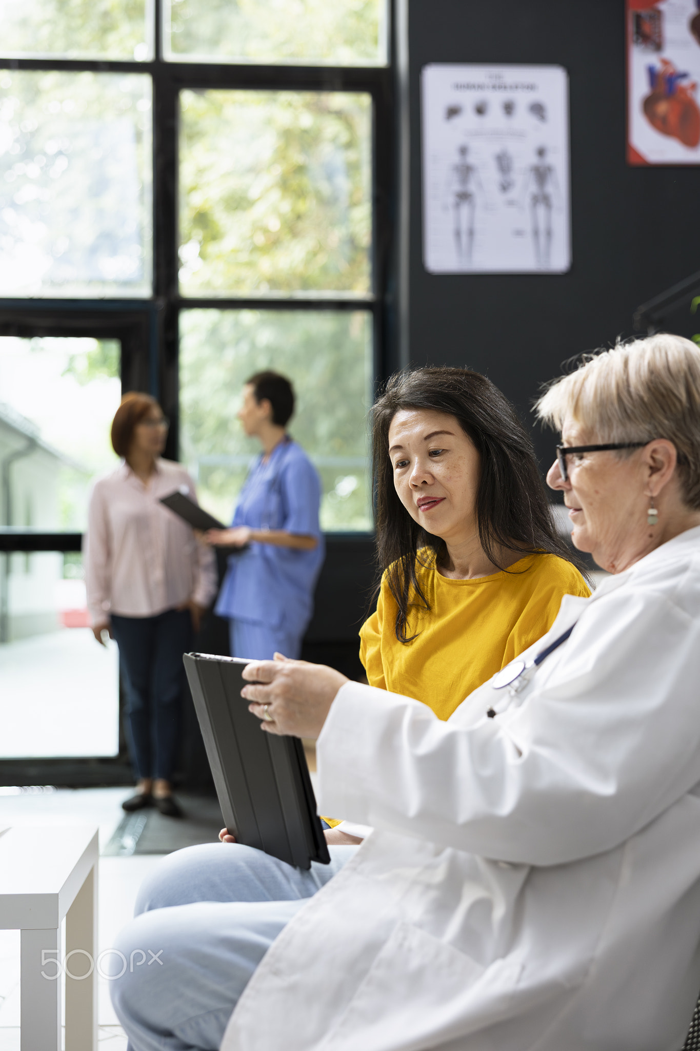 Diverse women meeting in a clinic lobby to discuss recovery steps