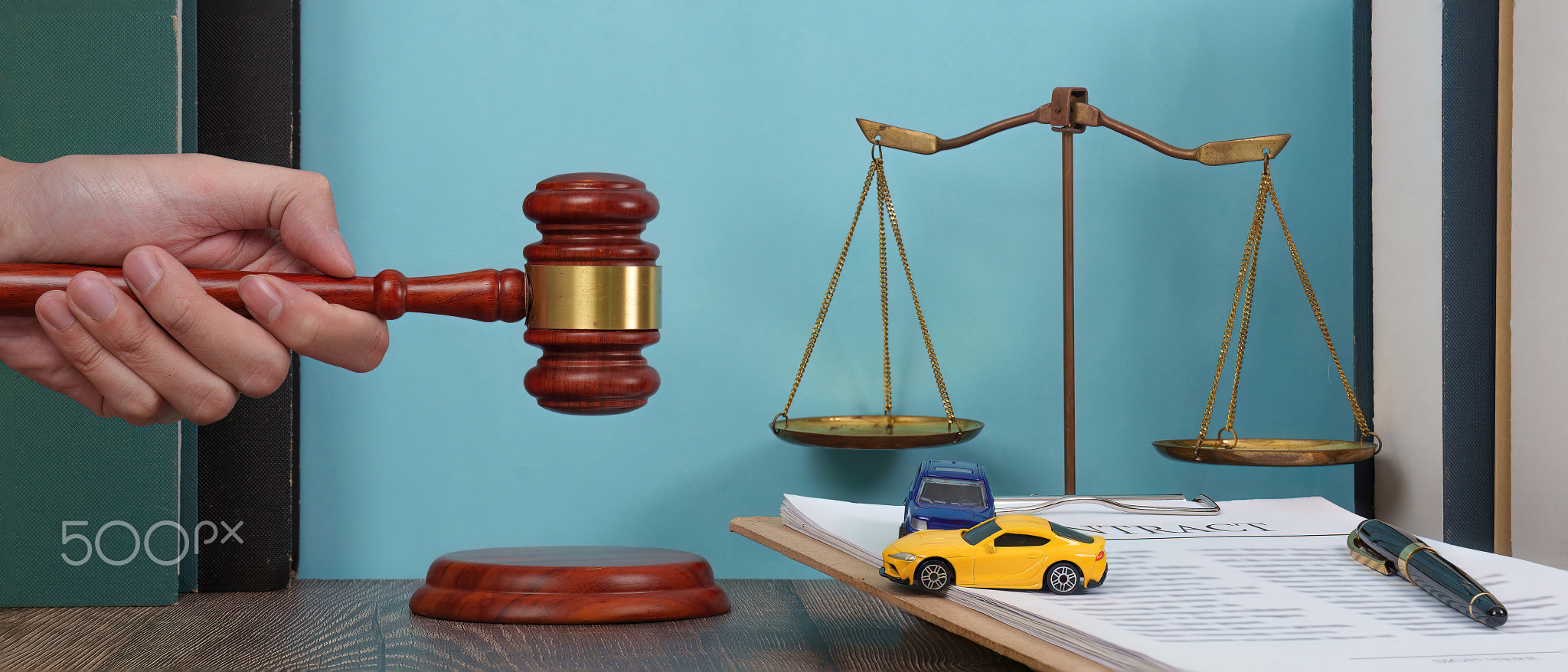 Legal Background with Scales and Cars. A lawyer's desk featuring a