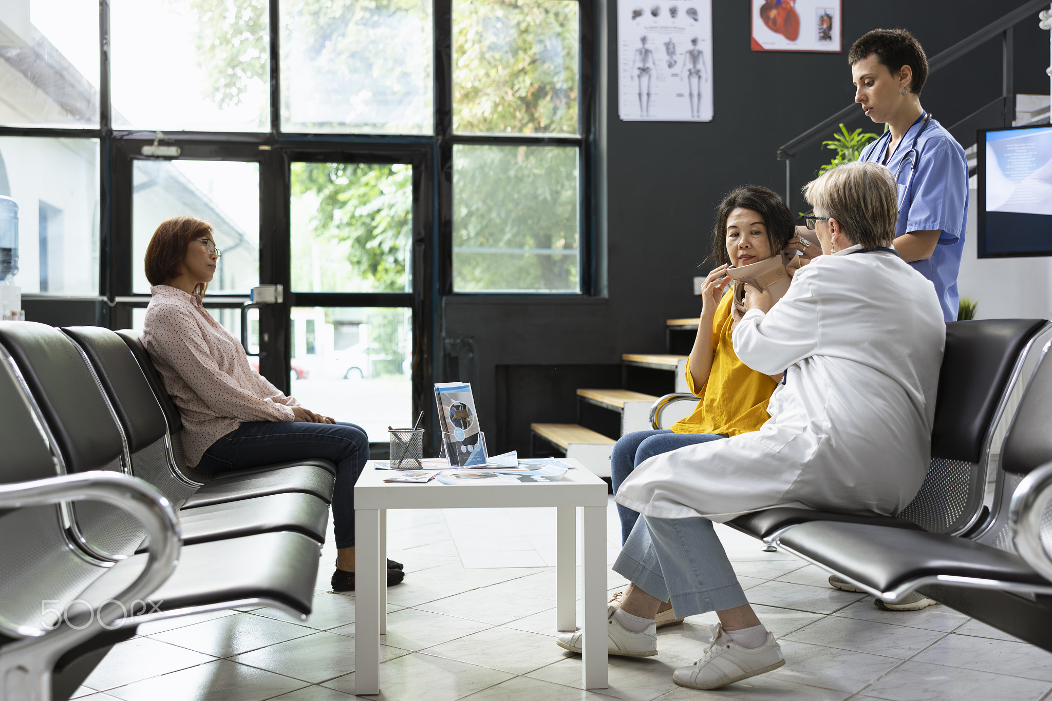 Healthcare workers placing cervical collar around patient neck to aid recovery