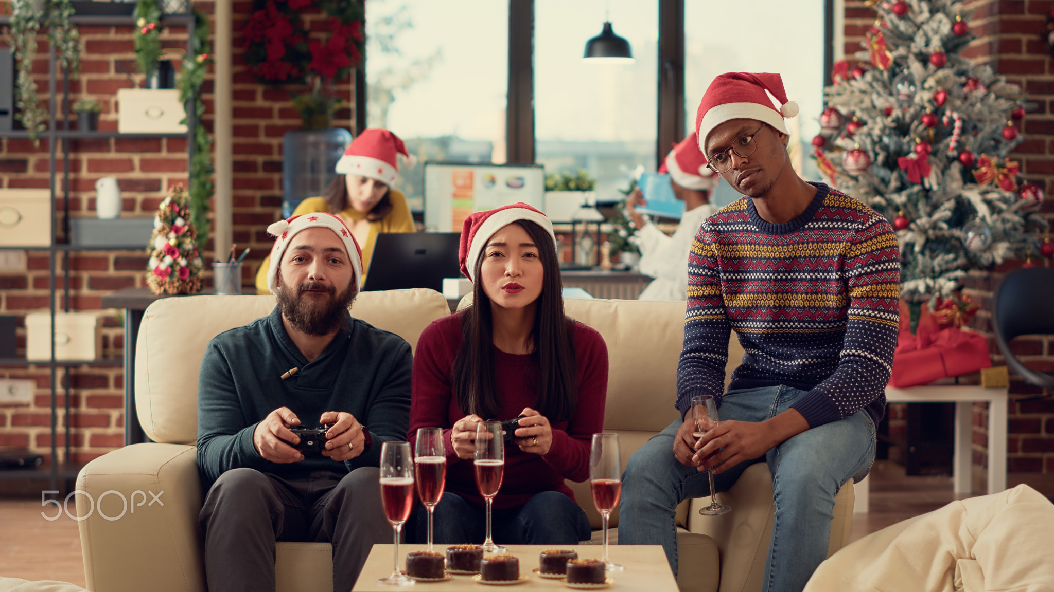 Diverse coworkers playing video games on console
