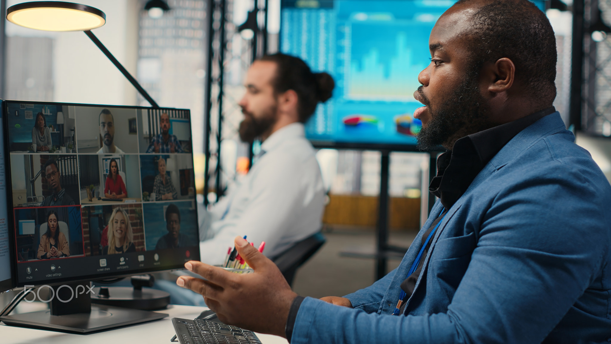 Black analyst meeting on online video call with associates to discuss insights