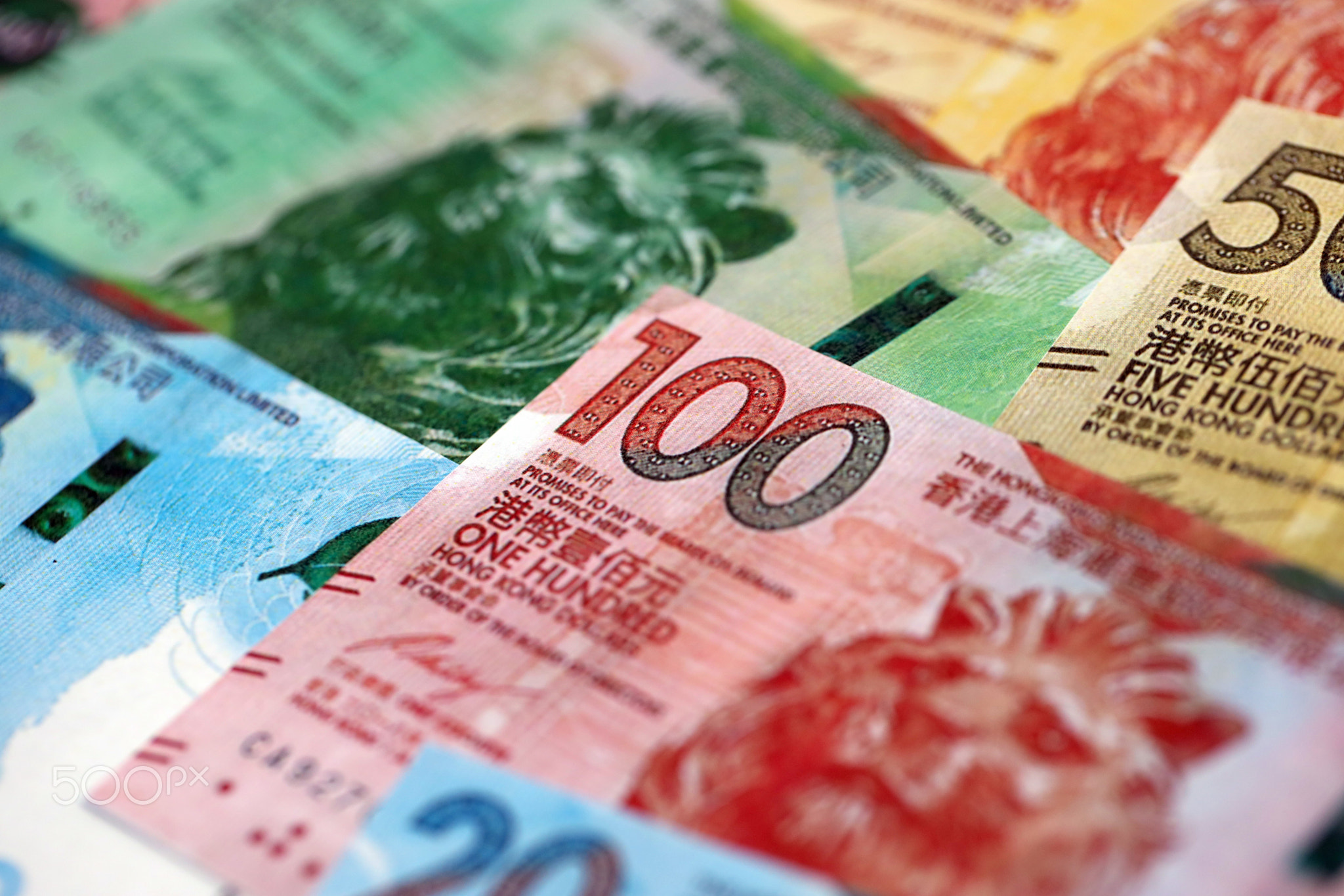 Big pile of Hong Kong dollars money bills banknotes. Lots of money of Chinese Hong Kong HKD cash