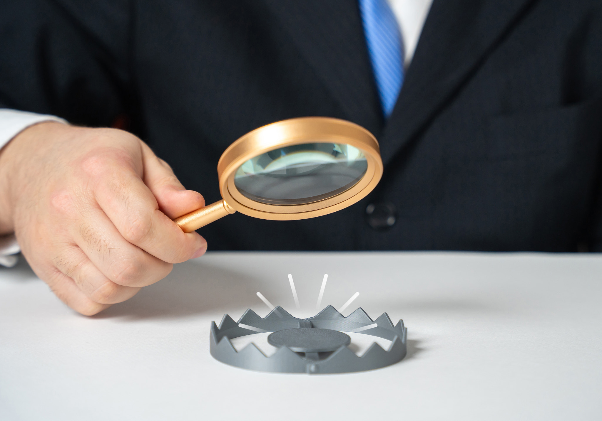 A businessman studies the trap. Rules for avoiding scams. Common mistakes newcomers make in business