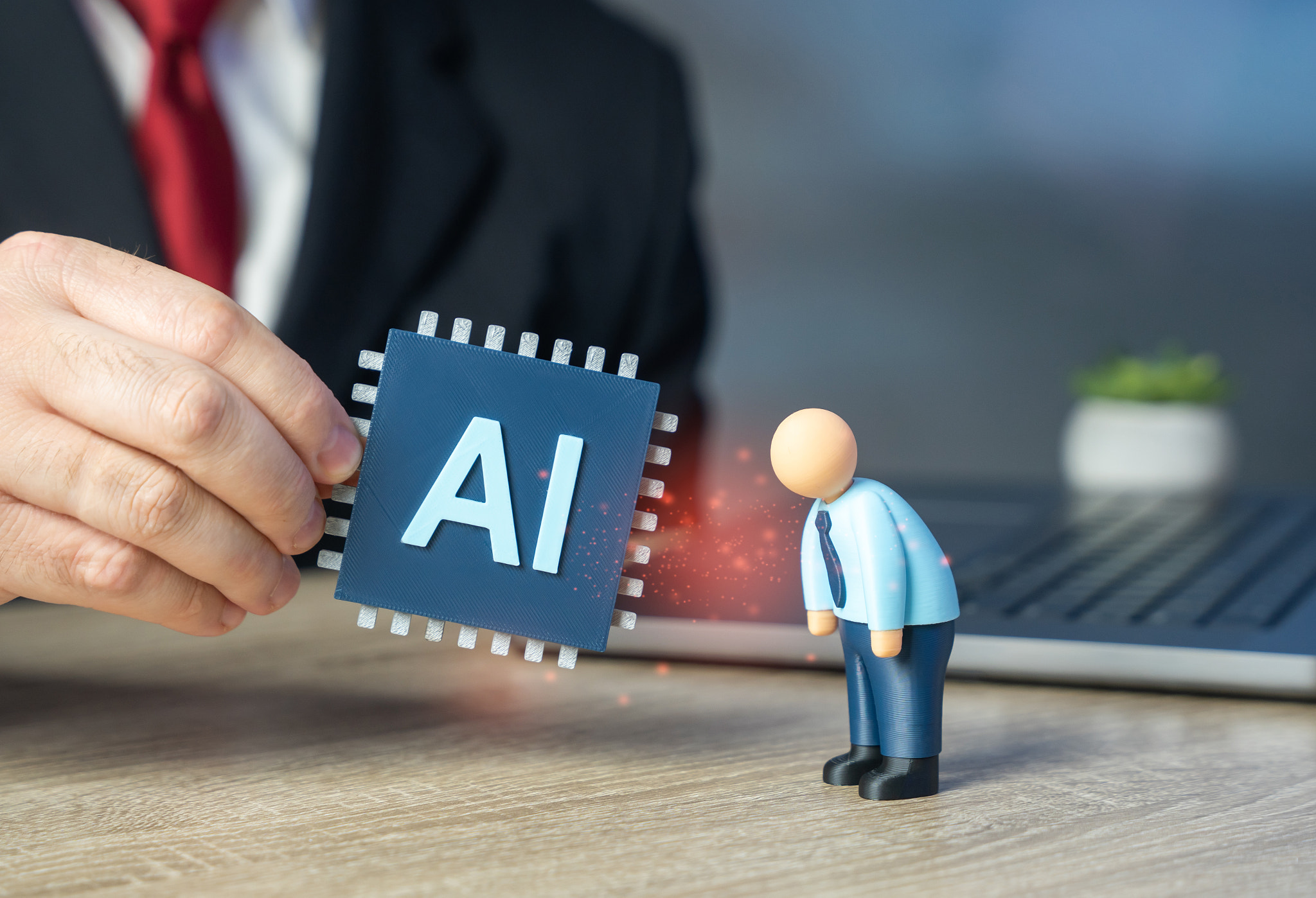 A sad office worker can be replaced with AI tools. Training in the use of artificial intelligence to